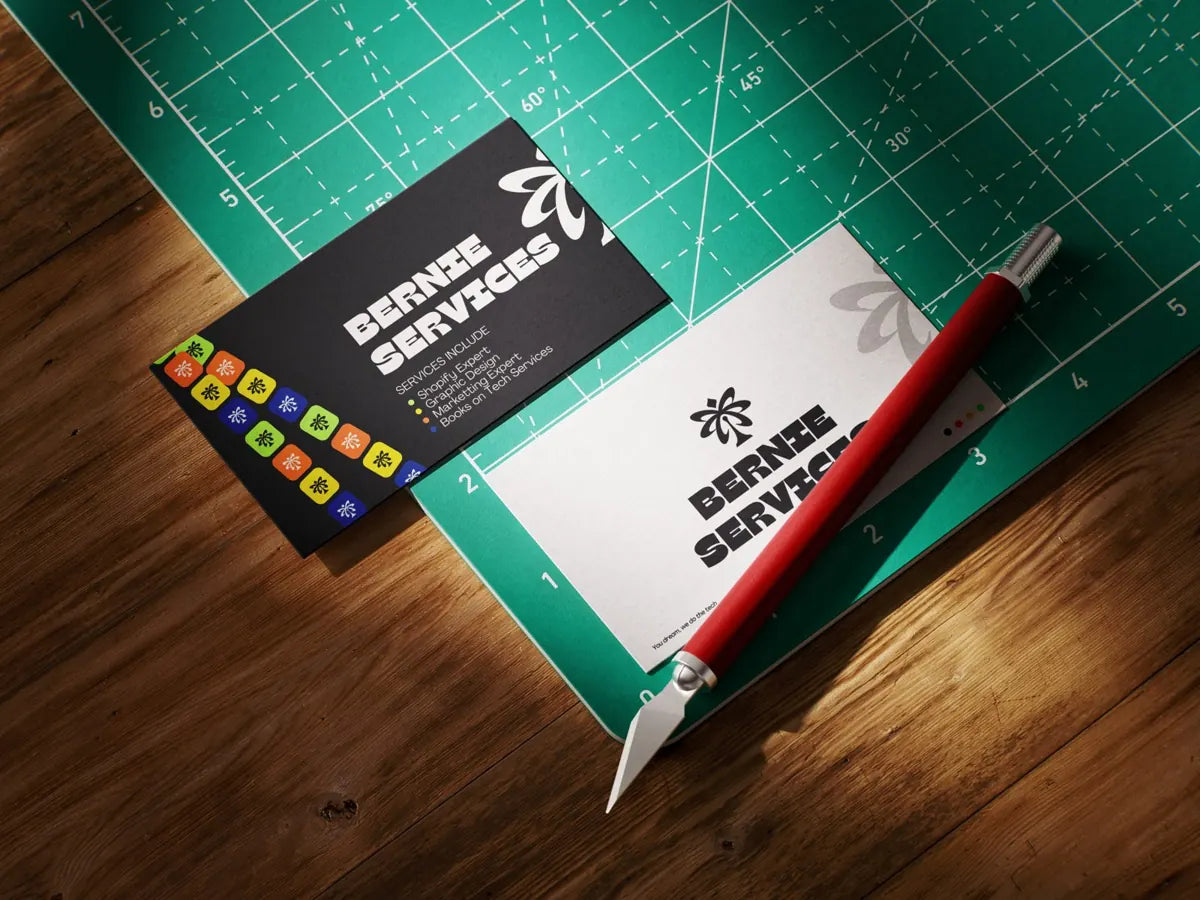 Bernie Services business cards on a cutting mat
